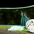 Elegant Art Installation With Woman In Blue Traditional Costume Bamboo Forest And Lotus Flowers