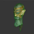 Ancient Greenish Bronze Mask Featuring Golden Accents And Intricate Facial Details