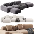 Cozy Modern Sectional Sofa With Soft Pillows And Throw Blanket In Neutral Tones