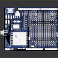 Blue Computer Circuit Board With White Components And Grid Pattern Pins 3d model
