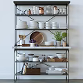 Organized Kitchenware Display On Shelving With Utensils Glassware Bowls Wooden Plate And Plants