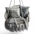 Cozy Woven Hanging Chair With Soft Patterned Pillows And Plaid Blanket