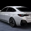 White Modern Sedan Car With Sleek Front Grille Design And Black Alloy Wheels