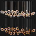 Elegant Modern Chandelier Design With Hanging Circular Metal Rings And Gold Accents