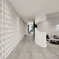 Modern Beauty Salon Interior with White Cylindrical Torn Design Black Chairs and Wooden Flooring
