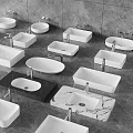 Various Shapes And Materials Of Modern Washbasins White Black Marble On Grey Floor With Faucets