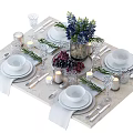 Complete Tableware Set With Bowls Plates Cutlery Wine Glasses Candles And Floral Decor