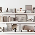 Modern Decorative Ornament Collection Display On Shelves With Books Frames And Sculptures