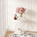 White Side Table with Pink Flowers in Vase and Decorative Figurine Against Decorative Wall