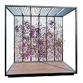 Modern Pergola with Black Metal Frame Latticed Roof Wooden Floor and Purple Vines