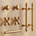 Golden Cabinet Knobs And Handles With Various Designs On Wooden Surface 3d model