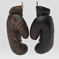 Two Old Worn Boxing Gloves Hanging As Vintage Sports Equipment