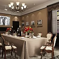 Classic Vintage Restaurant Interior With Long Dining Table Chandelier Framed Photos And Flower Arrangements