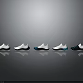Stylish Modern Sneakers In Various Colors Arranged For Display With Reflective Effect