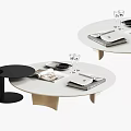 White Round Tabletop Coffee Table With Small Black Side Table And Magazines Plates Wine Glasses 3d model