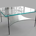 Modern Coffee Table With Glass Top Metal Legs And Decorative Items On Surface