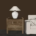 Wooden Console Cabinet Sideboard With White Table Lamp And Beige Sofa Blanket