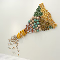 Colorful Cone Shaped Decorative Bead Art With Scattered Beads At Bottom