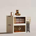 Modern White Storage Cabinet With Teddy Bear Folded Clothes And Metal Basket