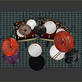 Colorful Toy Drum Set With Red Drums And Colored Cymbals On Green Mat