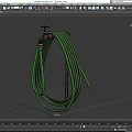Brass Faucet with Green Coiled Hose on Dark Background and Shadow Detail
