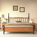 Cozy Wooden Double Bed with Black Metal Headboard Brown Comforter Nightstands Lamps and Wall Art
