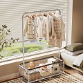 Clothing Hanger with Coats Sweaters Metal Storage Basket in Bedroom Near Window Blinds Green View