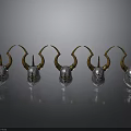 Five Silver Helmets With Golden Horns Arranged On Black Background With Reflections