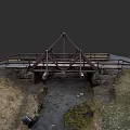 Metal Frame Bridge With Wooden Deck Spanning Stream Surrounded By Grass And Stones