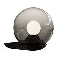 Modern Spherical Transparent Glass Table Lamp With Central Light Source And Black Base
