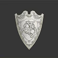 Silver Decorative Shield Featuring Ornate Carvings and Knight on Horseback Design