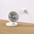 White Air Conditioner Fan on Wooden Tabletop with Modern Design Plugged into Wall Socket