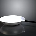 Silver Metal Wok With Black Handle And Shiny Reflective Surface