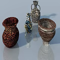 Four Decorative Vases With Diverse Patterns And Colors On Reflective Surface 3d model