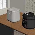 White Rice Cooker And Black Electric Pressure Cooker On Wooden Kitchen Counter With Geometric Wallpaper