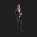 Man in Dark Suit Standing with Hands Crossed Against Black Background