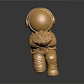 Golden Astronaut Sculpture Kneeling Holding Decorative Flower Like Disc With Metallic Finish