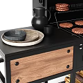 Outdoor Barbecue Setup With Grill Firewood Spices Bottles And Utensils