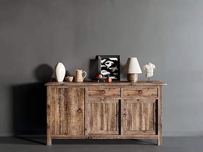 Rustic Wooden Sideboard Featuring White Vase Picture Frame Table Lamp And Sculpture Against Gray Wall 3d model