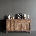 Rustic Wooden Sideboard Featuring White Vase Picture Frame Table Lamp And Sculpture Against Gray Wall