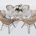 Round Glass Dining Table And Rattan Chairs Set With Black Metal Legs And Flower Vase