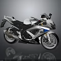 White And Blue Suzuki Sports Motorcycle With Black Seat Alloy Wheels And Sporty Design