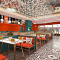 Vibrant Restaurant Interior With Orange Walls Red Seats White Tables And Crystal Chandeliers