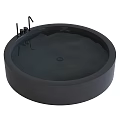 Elegant Black Round Freestanding Bathtub With Modern Faucet And Water Ripples