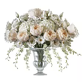 Glass Vase With White And Blush Roses Hydrangeas Small White Flowers And Green Foliage