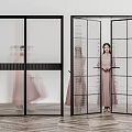 Black Frame Glass Doors Grid Design And Woman In Pink Dress Behind Open Door