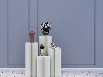 White Cylindrical Display Shelves With Mannequin Vase High Heels And Potted Plant 3d model
