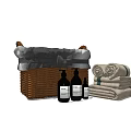 Woven Storage Basket with Folded Towels and Bath Toiletries for Bathroom Organization