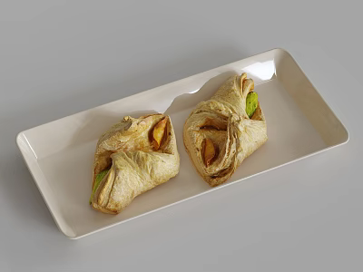 Two Pieces Golden Crust Pastry With Green Filling On White Rectangular Plate 3d model