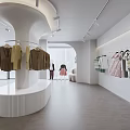 Modern Minimalist Clothing Store Interior With Hanging Apparel And Display Racks